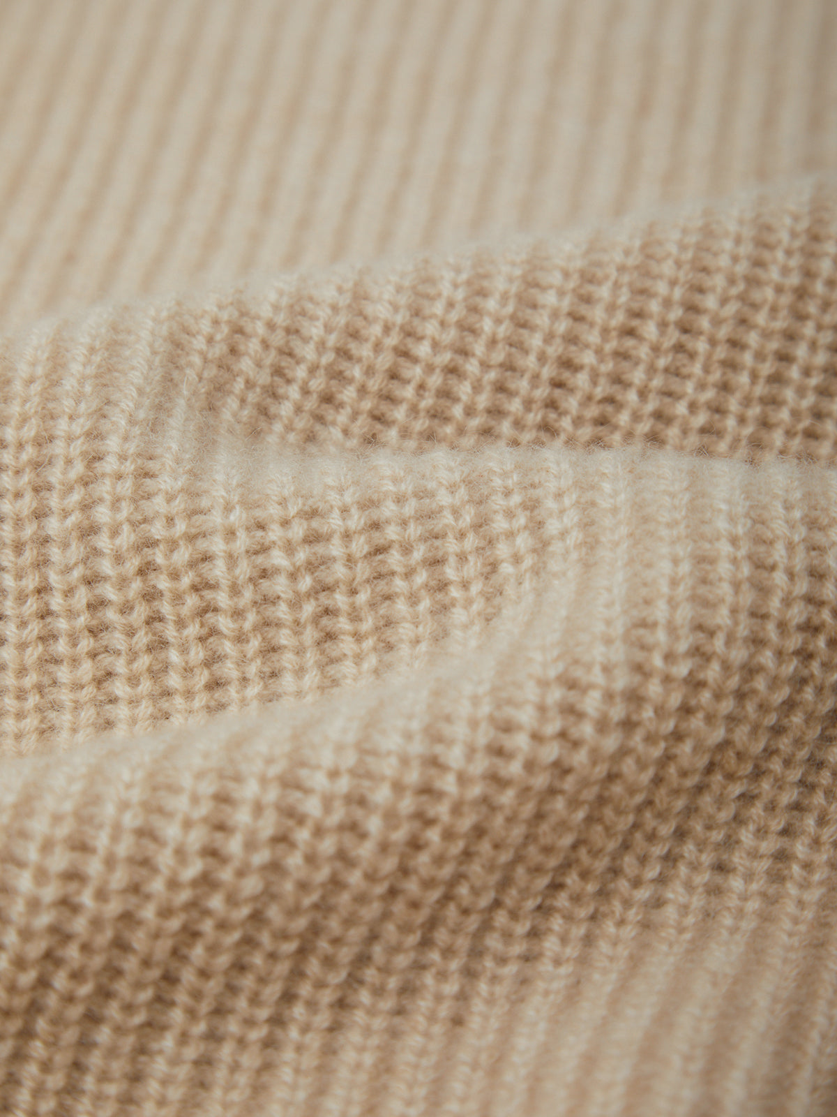 Close-up of beige woven fabric texture
