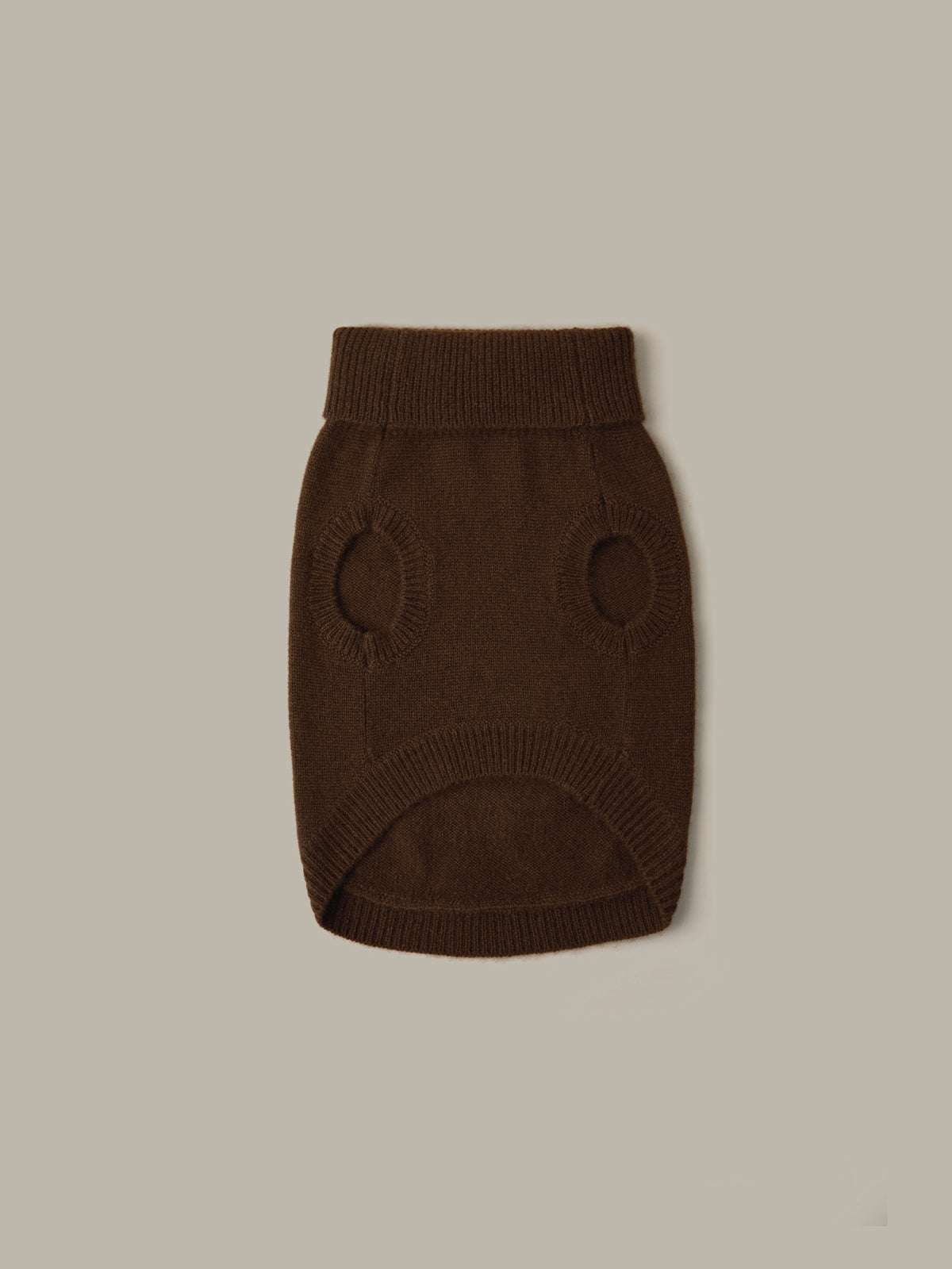 Brown knitted dog sweater on a beige background