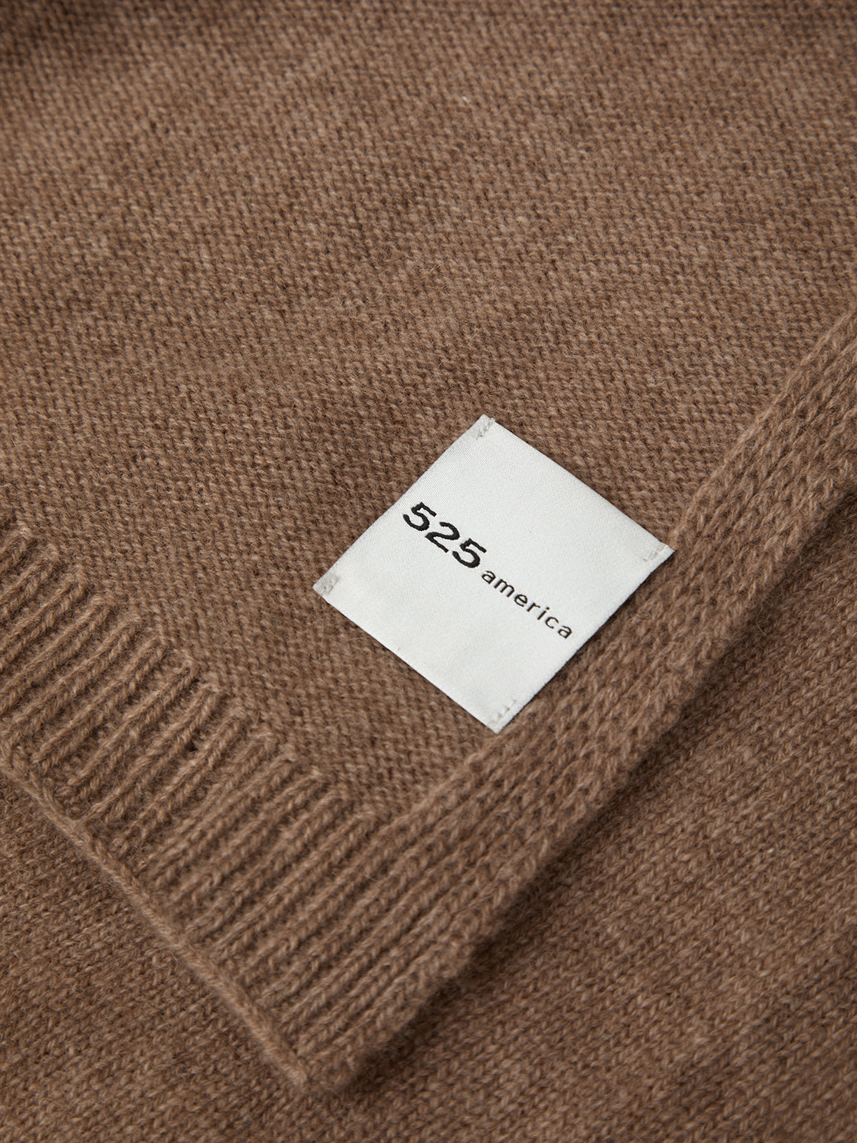 Brown fabric with a white label featuring '525 america' on a matching brown background