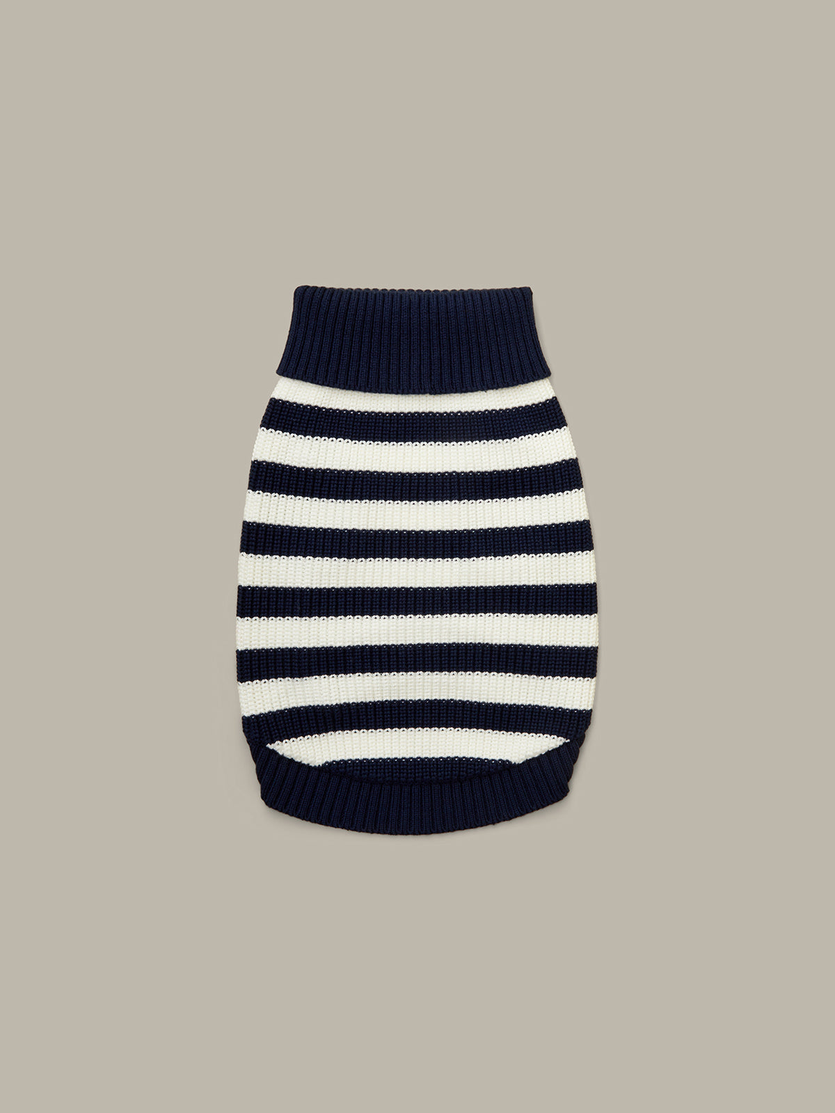 Navy and white striped dog sweater on a beige background