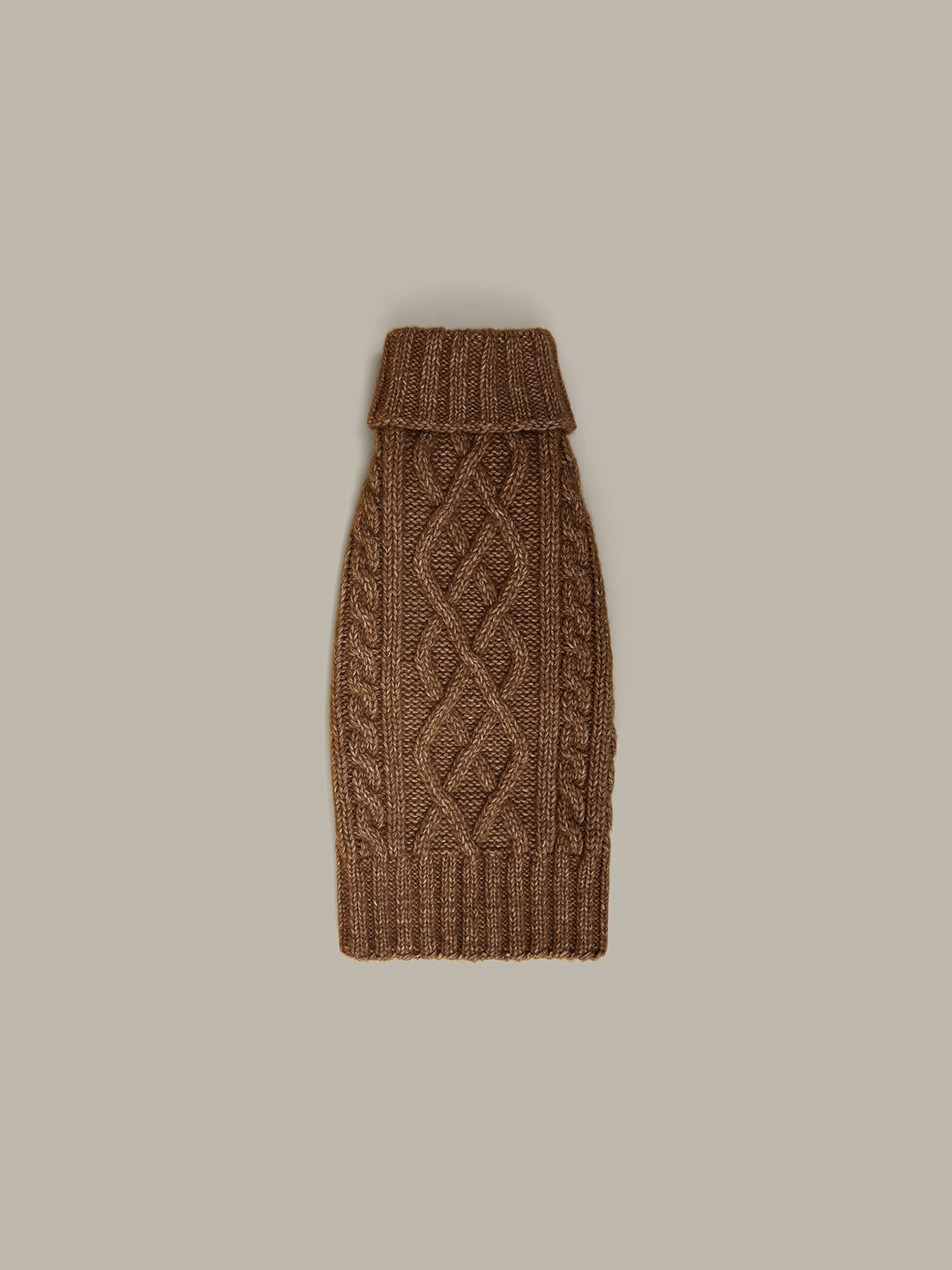 Brown knitted pet sweater on a beige background