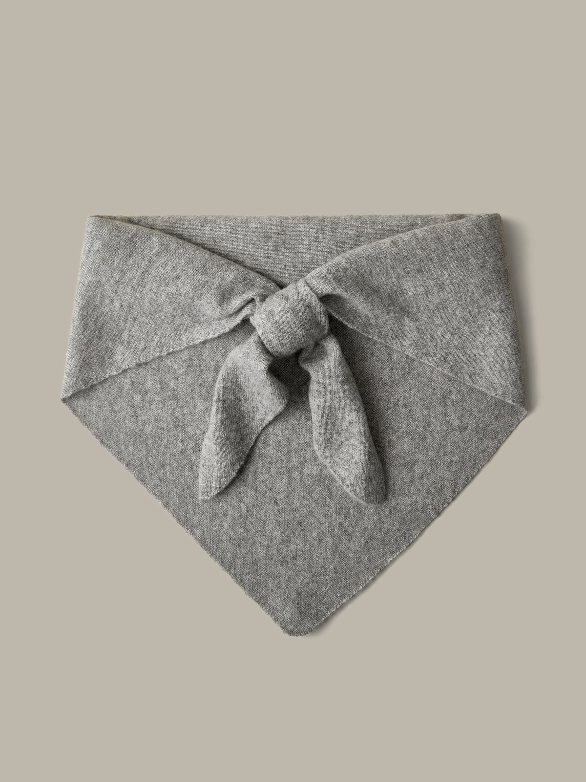 Gray knotted headband on a beige background